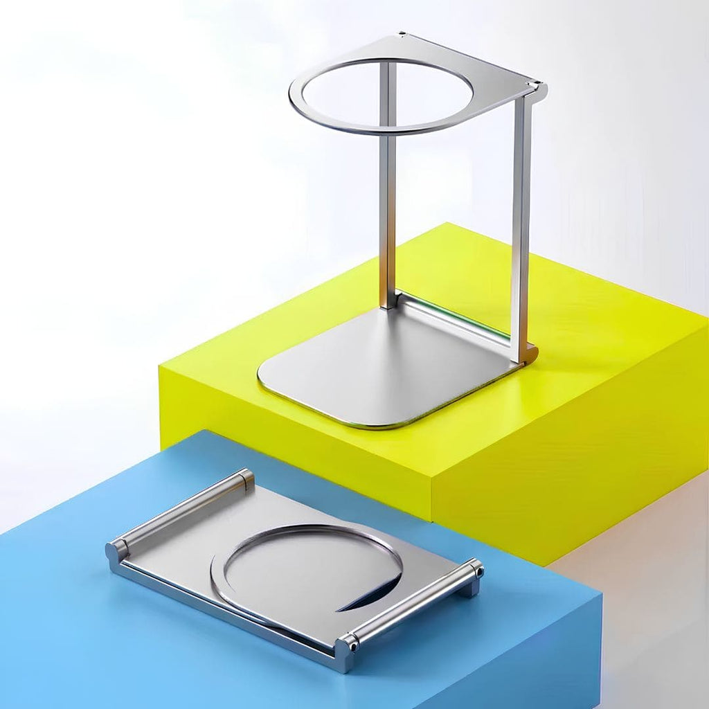 The Gustosa Bracket displayed in two positions — fully assembled as a stand and folded flat — on colorful geometric blocks, showcasing its compact foldable design and premium all-metal construction