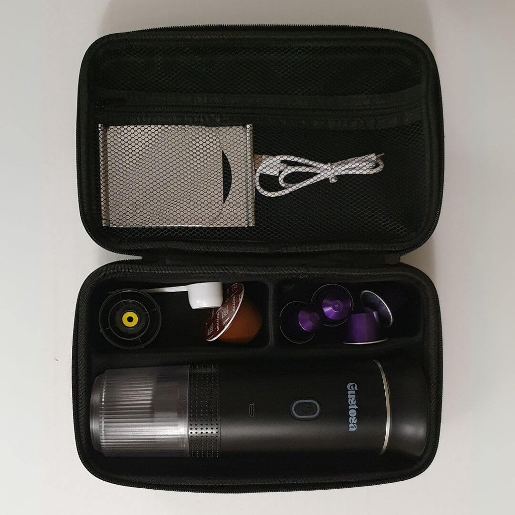 Open Gustosa bag showing portable coffee maker, charging cable, capsules, and accessories – compact and organized