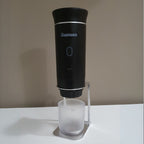 Gustosa portable coffee maker mounted on bracket accessory with cup underneath